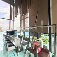 Modern dining area with large windows and city view