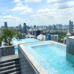 Rooftop infinity pool with city skyline view