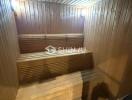 Well-lit wooden sauna with benches