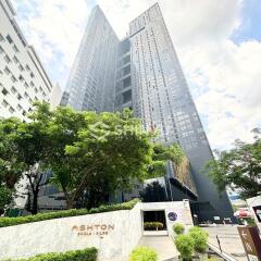 High-rise residential building with landscaped surroundings