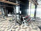 Modern fitness center with gym equipment and city view