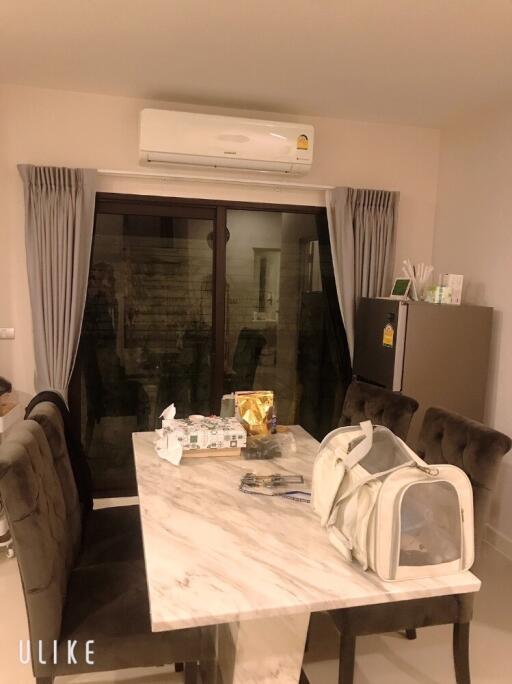 Dining area with marble table and air conditioner