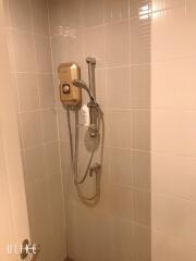 Bathroom shower area with water heater