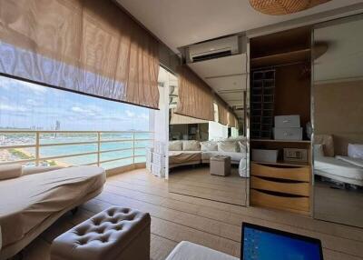 Bedroom with large windows and sea view