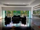 spacious seating area with glass wall and natural light