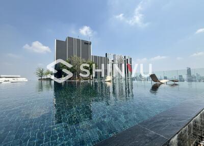 Rooftop infinity pool with city skyline