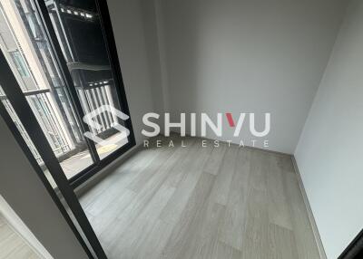 Empty room with wooden flooring and natural light