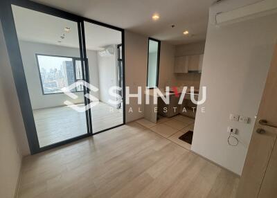 Modern living area with kitchen and city view