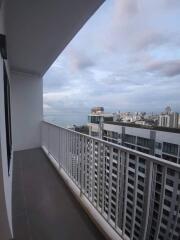 High-rise balcony with city and sea view