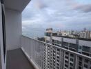 High-rise balcony with city and sea view