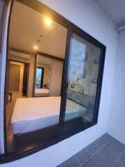 Cozy bedroom with a view through glass windows