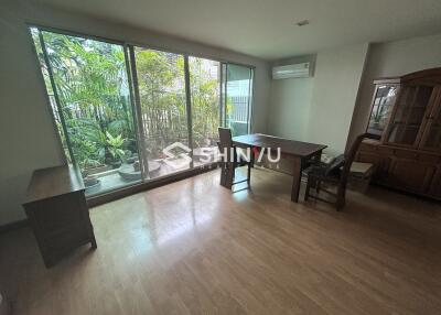 Spacious dining room with large windows and garden view