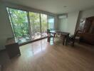 Spacious dining room with large windows and garden view