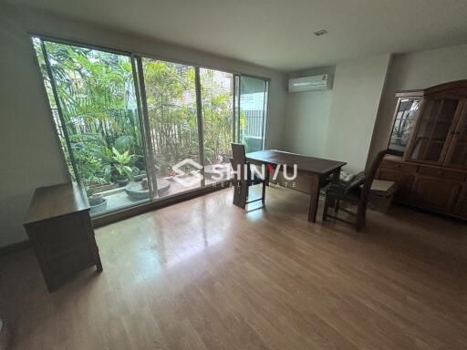 Spacious dining room with large windows and garden view