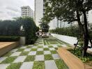 Outdoor communal garden with seating and greenery