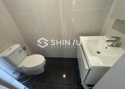 Small modern bathroom with toilet and sink