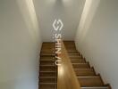 Staircase with wooden steps and bright lighting