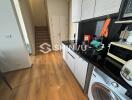 Modern kitchen with appliances and wooden flooring