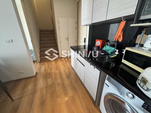 Modern kitchen with appliances and wooden flooring