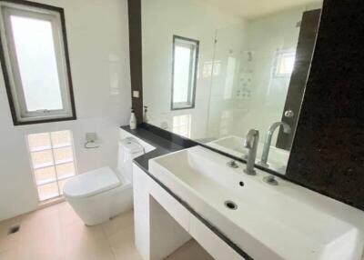 Modern bathroom with large mirror and dual sinks