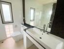 Modern bathroom with large mirror and dual sinks