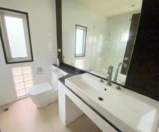 Modern bathroom with large mirror and dual sinks