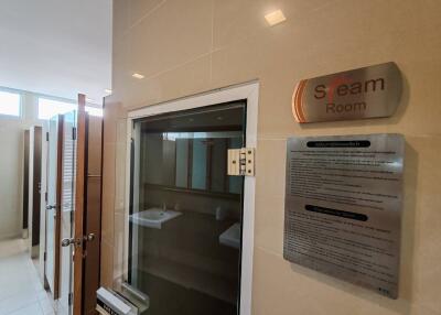 Steam room entrance with description board