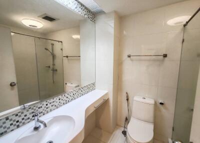 Modern bathroom with a large mirror and shower