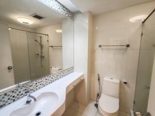 Modern bathroom with a large mirror and shower