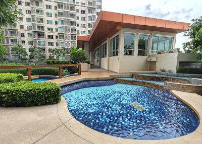 Outdoor area with swimming pool and adjacent building