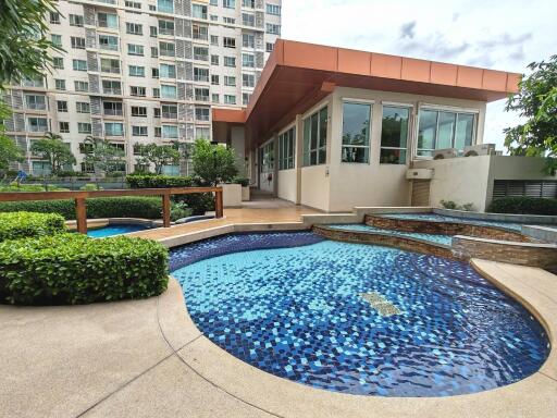 Outdoor area with swimming pool and adjacent building