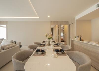 Modern open-concept dining and living space with elegant decor