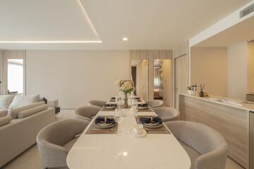 Modern open-concept dining and living space with elegant decor