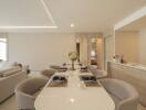 Modern open-concept dining and living space with elegant decor