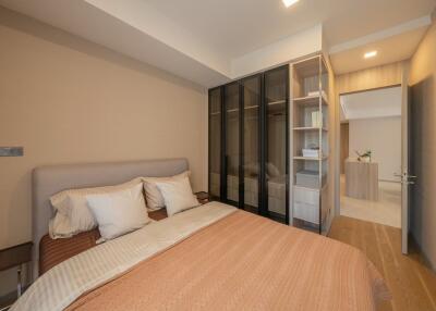 Modern bedroom with cozy bed, wardrobe and soft lighting