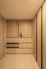 Modern minimalist storage room with built-in shelving and cabinets