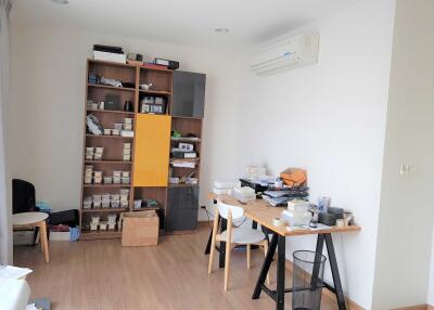 Home office with desk and storage shelves