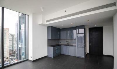 Modern apartment kitchen with a view of the city