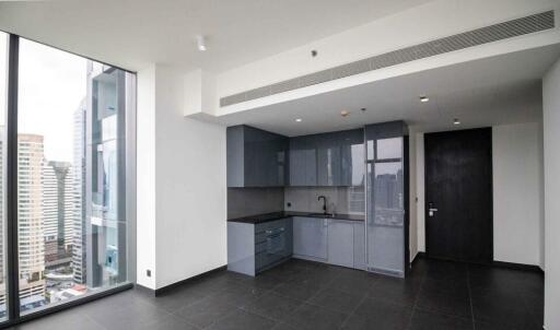 Modern apartment kitchen with a view of the city