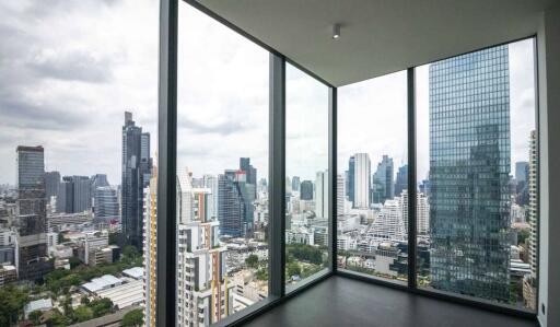 High-rise corner window view of city skyline