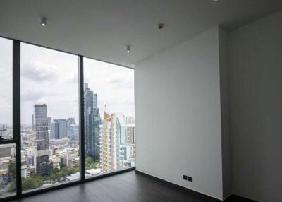 Living room with large windows and city view