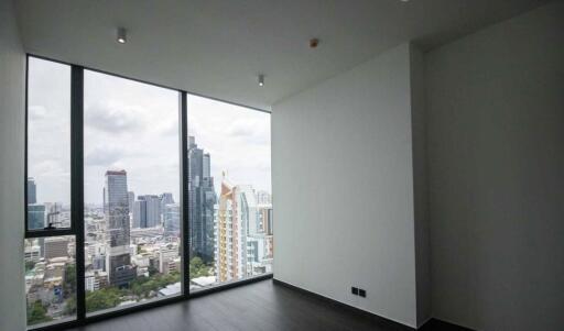 Living room with large windows and city view