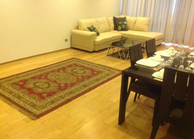 Living room with dining area and rug