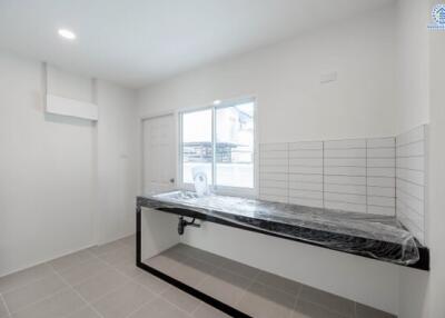 Modern kitchen with tiled floor and minimalist design