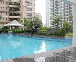 Outdoor swimming pool with adjacent buildings