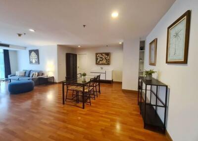 Spacious living room with wooden flooring and modern furniture