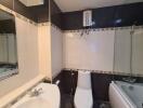 Modern bathroom with white and black tile design