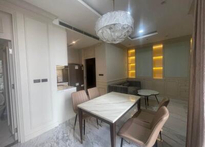 Modern dining room with marble flooring and contemporary lighting