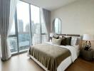 Modern bedroom with large windows and city view