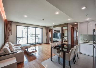 Modern living room with dining area and kitchen